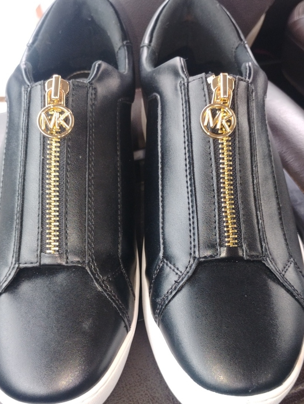 Michael Kors Black Leather Zip-Front Slip-On Sneakers with Gold Hardware